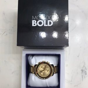 Gold Movado watch.